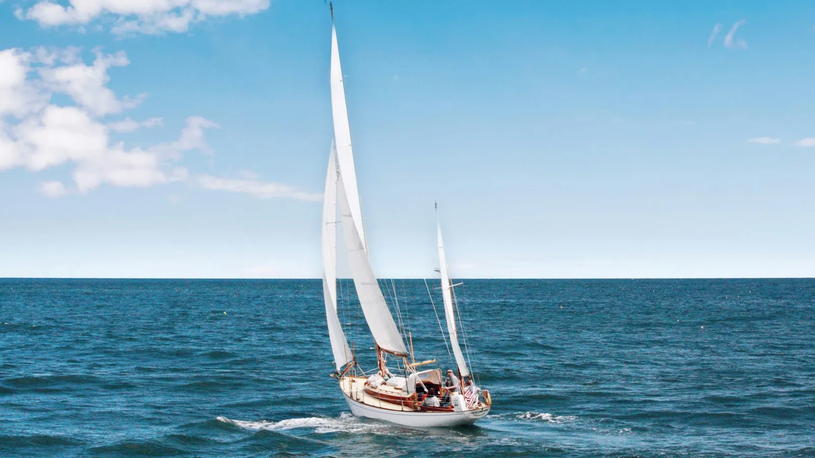 Sailing yacht cutting through blue water
